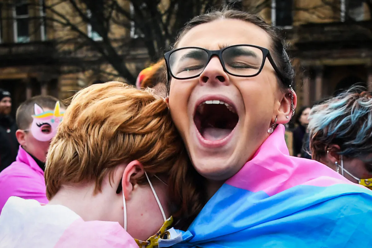 Trans rights activists react while taking part in a counter protest to the "Let Women Speak" rally in Glasgow, on Feb. 5, 2023. (Andy Buchanan/AFP via Getty Images)