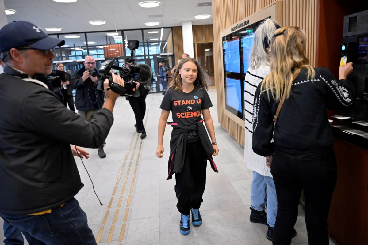 Swedish climate activist Greta Thunberg walks in Malmo district court, in Sweden, on Oct. 11, 2023. (TT News Agency/Johan Nilsson via Reuters)
