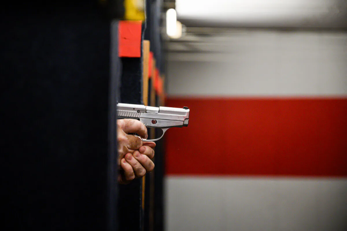 A person aims his pistol at a shooting range in New York on June 23, 2022. (Ed Jones/AFP via Getty Images)