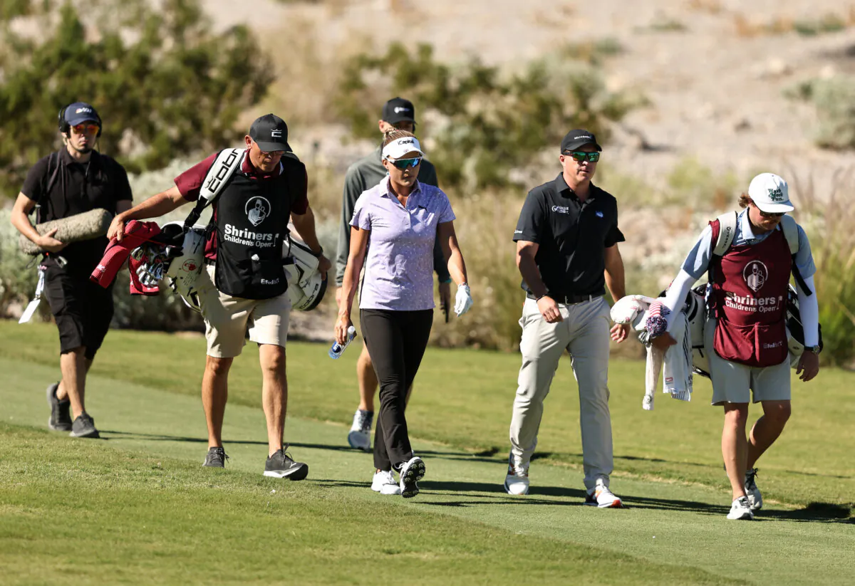 Lexi Thompson of the United States along with Kevin Roy of the United States and Trevor Werbylo of the United States walk on the fourth hole during the first round of the Shriners Children's Open at TPC Summerlin in Las Vegas on Oct. 12, 2023. (Michael Owens/Getty Images)