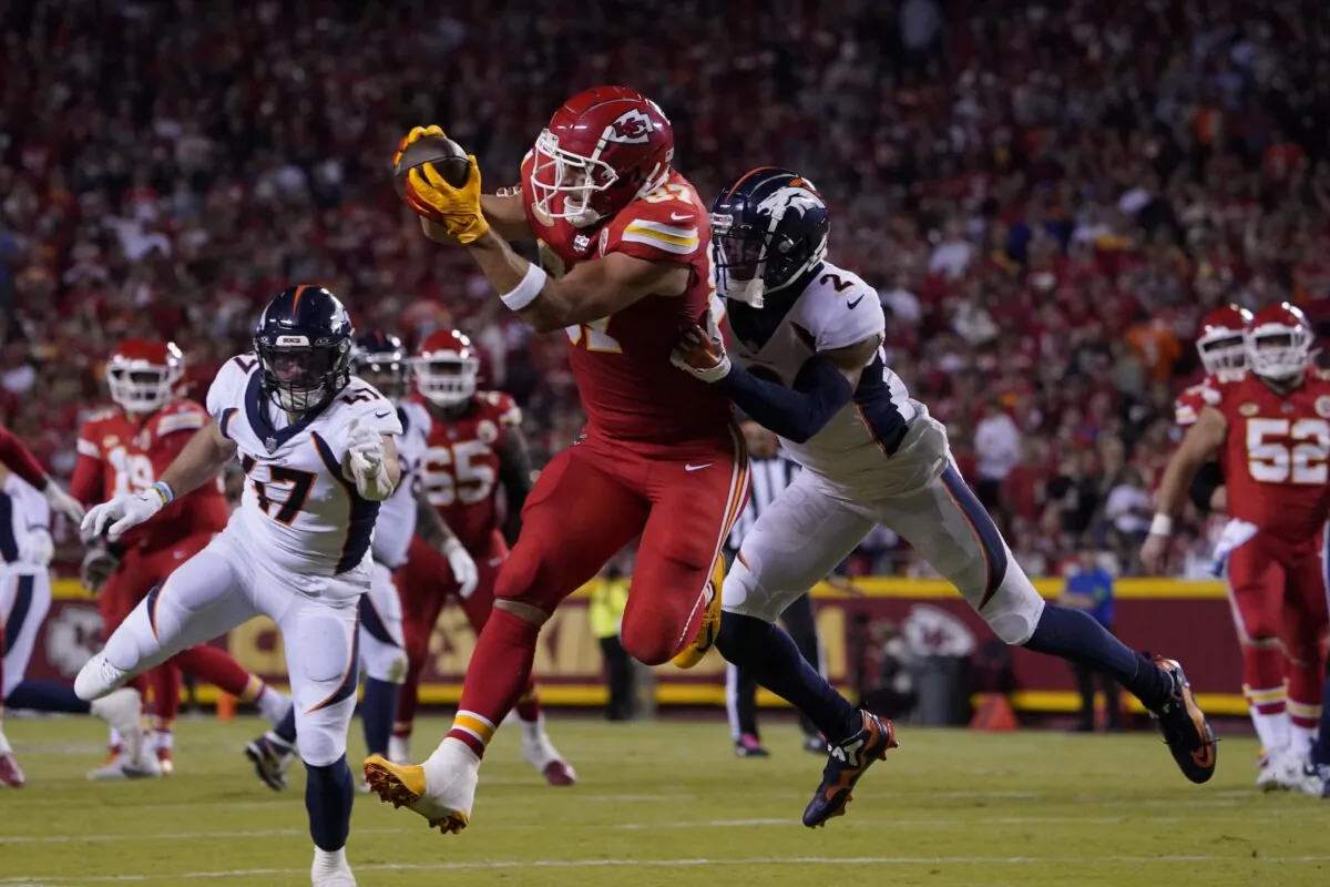 Kansas City Chiefs tight end Travis Kelce (87) makes a catch against Denver Broncos' Pat Surtain II (2) during the first half of an NFL football game in Kansas City on Oct. 12, 2023. (Ed Zurga/AP Photo)