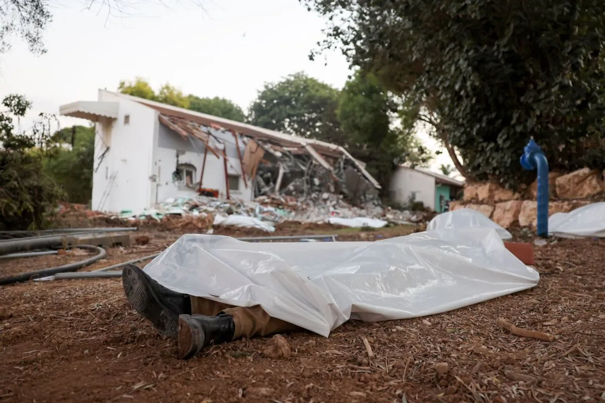 A picture taken on Oct. 11, 2023, shows covered bodies at kibbutz Beeri near the border with Gaza, the site of an attack by Hamas terrorists days earlier. (Jack Guez/AFP via Getty Images)