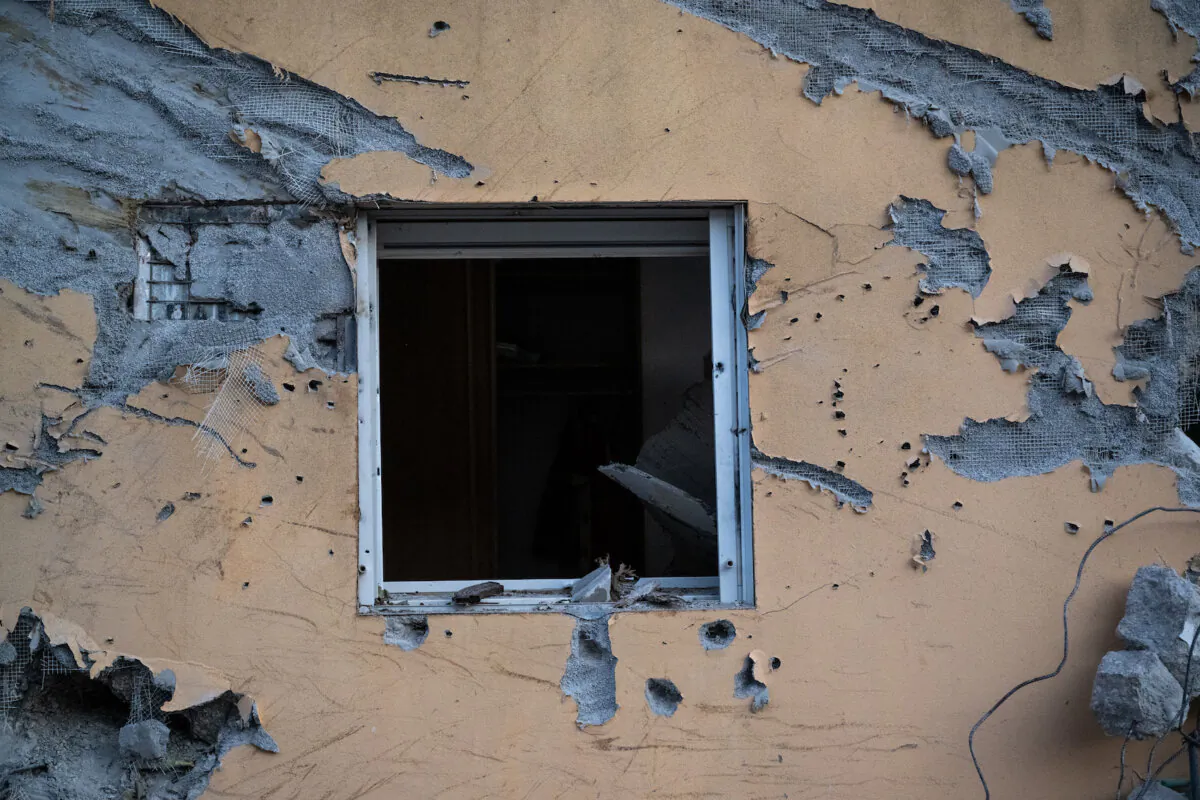 The window of a house is broken and the wall around it is covered in bullet holes where days earlier Hamas terrorists killed civilians near the border with Gaza in Be'eri, Israel, on Oct. 11, 2023. (Alexi J. Rosenfeld/Getty Images)