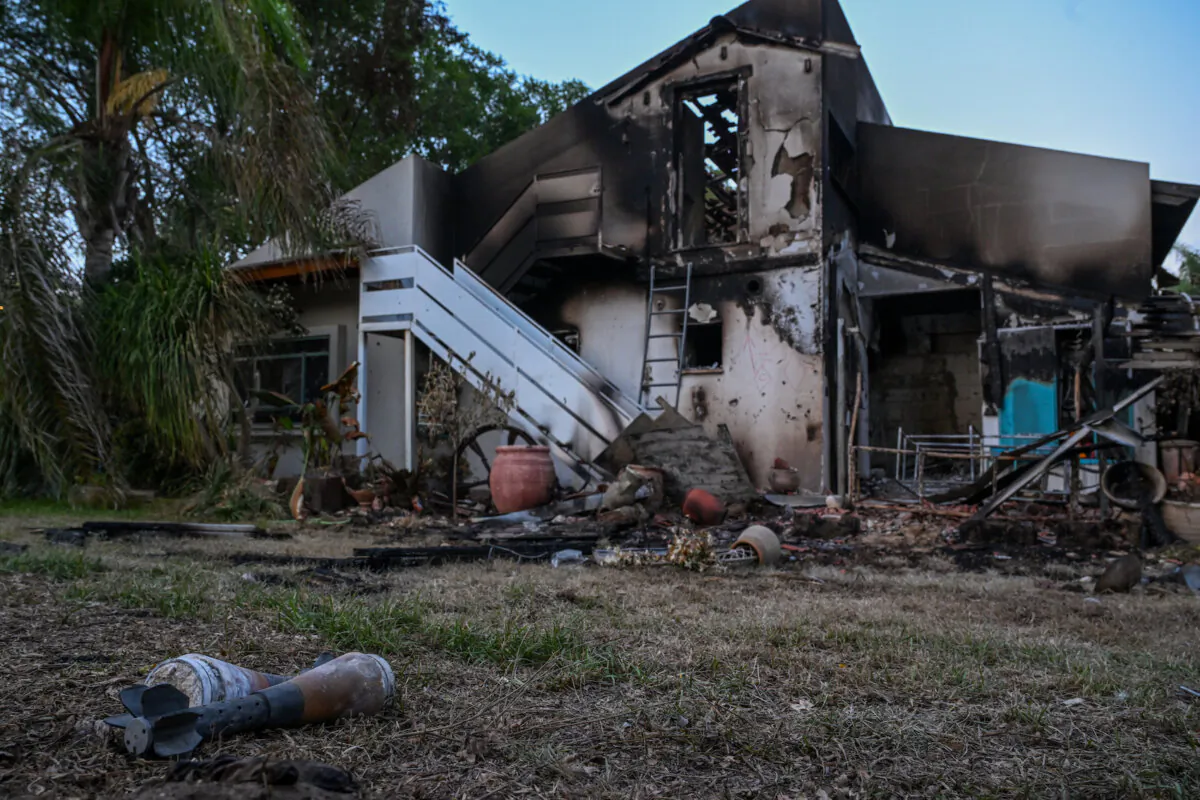 Rocket shells are left on the grass outside a house on Oct. 11, 2023 where civilians and soldiers were killed by Hamas terrorists days earlier in Be'eri, Israel. (Alexi J. Rosenfeld/Getty Images)