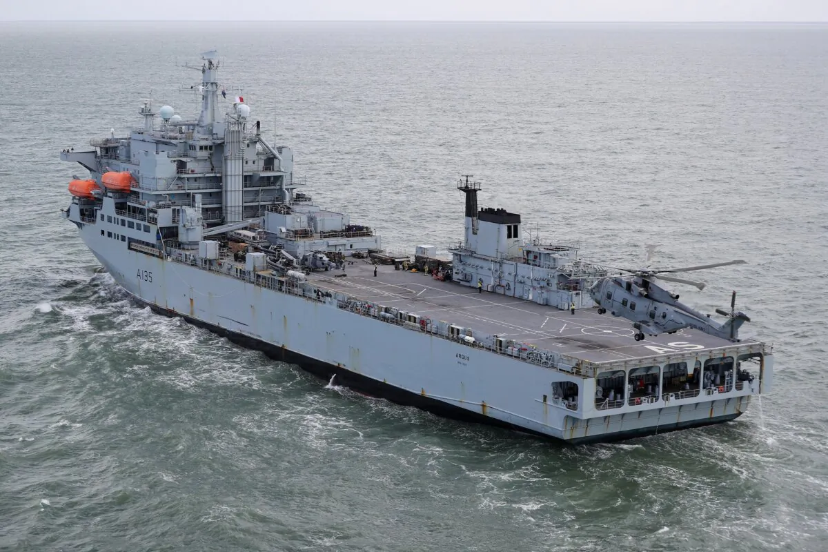 Undated handout photo of a Merlin Helicopter from 845 Naval Air Squadron recovering to the flight deck of RFA Argus off the coast of Honduras after completing aerial damage survey. (LPhot Robert Oates/Ministry of Defence via PA)