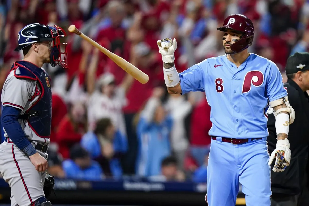 Philadelphia Phillies' Nick Castellanos flips his bat after hitting a home run during the sixth inning of Game 4 of a baseball NL Division Series against the Atlanta Braves in Philadelphia on Oct. 12, 2023. (Chris Szagola/AP Photo)
