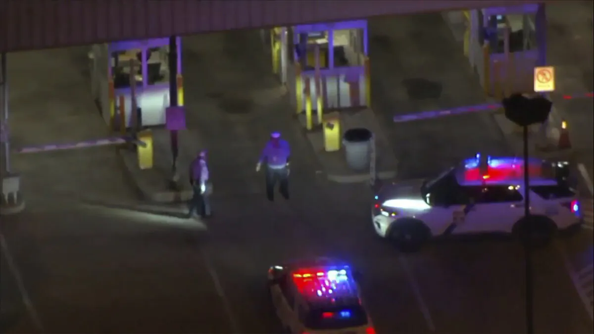 Police cars and officers around a Philadelphia International Airport parking garage in Philadelphia on Oct. 12, 2023. (WPVI-TV via AP)