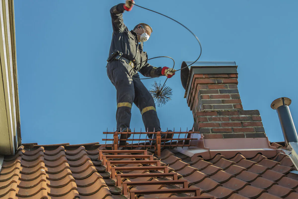 A chimney sweep will use various tools to clear out debris. (Dreamstime/TNS)