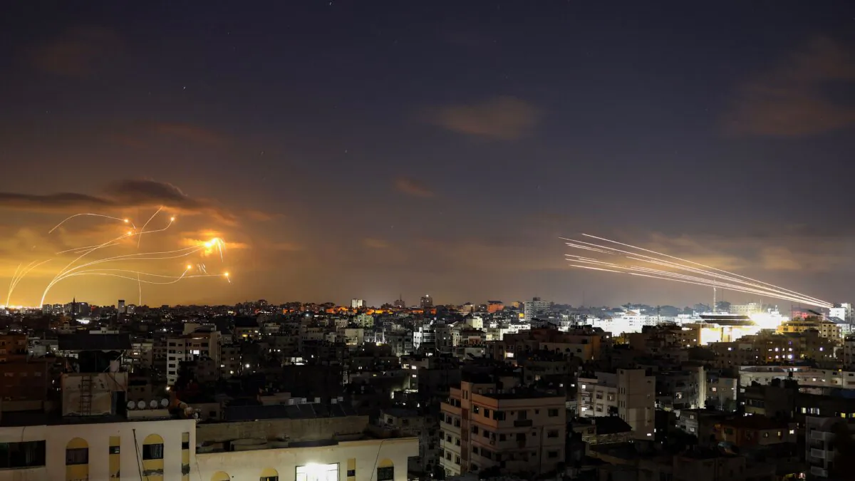 Rockets fired from the Gaza City (R) are intercepted by Israel's Iron Dome defense missile system (L) on Oct. 10, 2023. (Eyad Baba AFP via Getty Images)