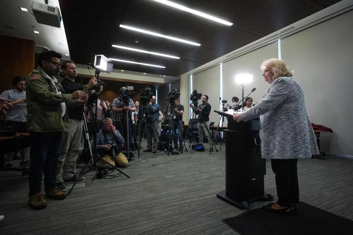 Surrey Mayor Brenda Locke listens during a news conference about the city's municipal police force transition, in Surrey, B.C., on April 28, 2023. (The Canadian Press/Darryl Dyck)
