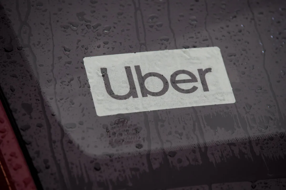 An Uber sign in a vehicle is seen after the company launched service in Vancouver, on Jan. 24, 2020. (The Canadian Press/Darryl Dyck)