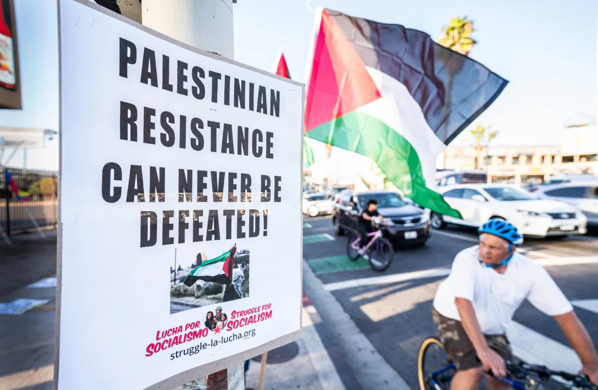 Protesters wave Palestinian flags in support of Palestinians and socialism in Los Angeles on Oct. 12, 2023. (John Fredricks/The Epoch Times)