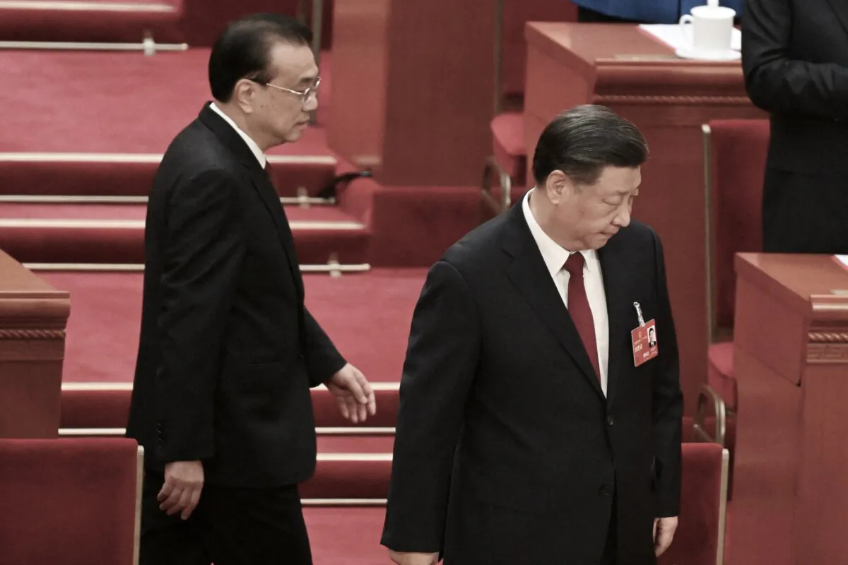 China's President Xi Jinping (R) and former Premier Li Keqiang arrive for the closing session of the National People's Congress (NPC) at the Great Hall of the People in Beijing on March 13, 2023. (NOEL CELIS/POOL/AFP via Getty Images)