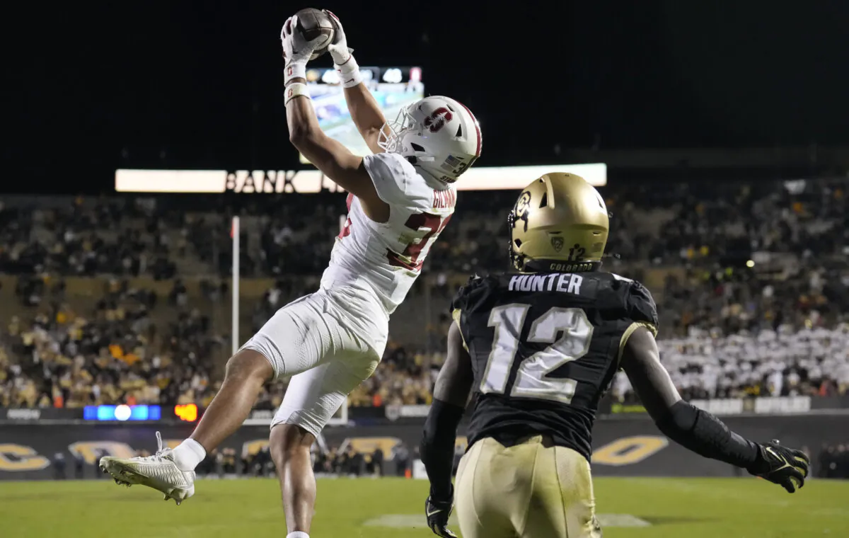 Stanford safety Alaka'i Gilman, left, intercepts a pass intended for Colorado wide receiver Travis Hunter in the end zone in overtime of an NCAA college football game in Boulder, Colo., on Oct. 13, 2023.(David Zalubowski/AP Photo)