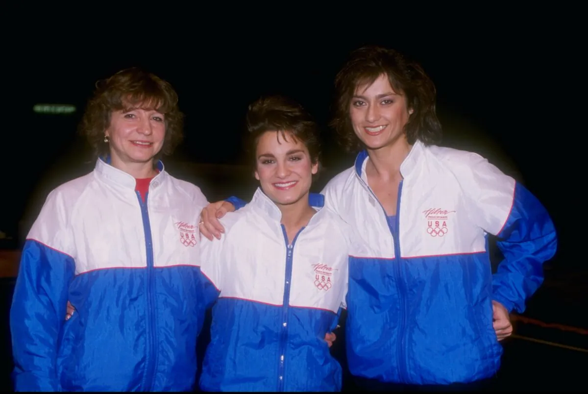 (L–R) Olga Korbut, Mary Lou Retton, and Nadia Comaneci pose for a picture during the Gymnastics Stars at the Great Western Forum in Inglewood, Calif., on March 28, 1992. (Getty Images)