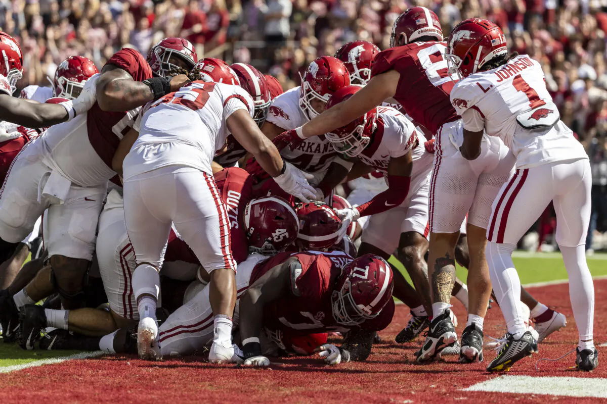 Alabama scores on quarterback Jalen Milroe's (4) interior run during the first half of an NCAA college football game against Arkansas in Tuscaloosa, Ala., on Oct. 14, 2023. (Vasha Hunt/AP Photo)