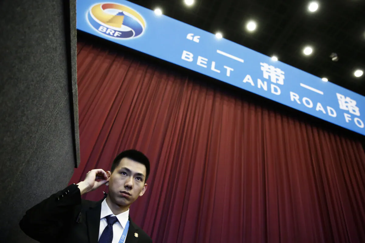 A security guard stands at the entrance to the opening ceremony of the Belt and Road Forum on May 14, 2017 in Beijing, China. (Thomas Peter - Pool/Getty Images)