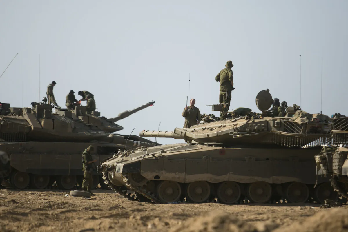Israeli soldiers stand by tanks near the border with Gaza near Sderot, Israel, on Oct. 14, 2023. (Amir Levy/Getty Images)