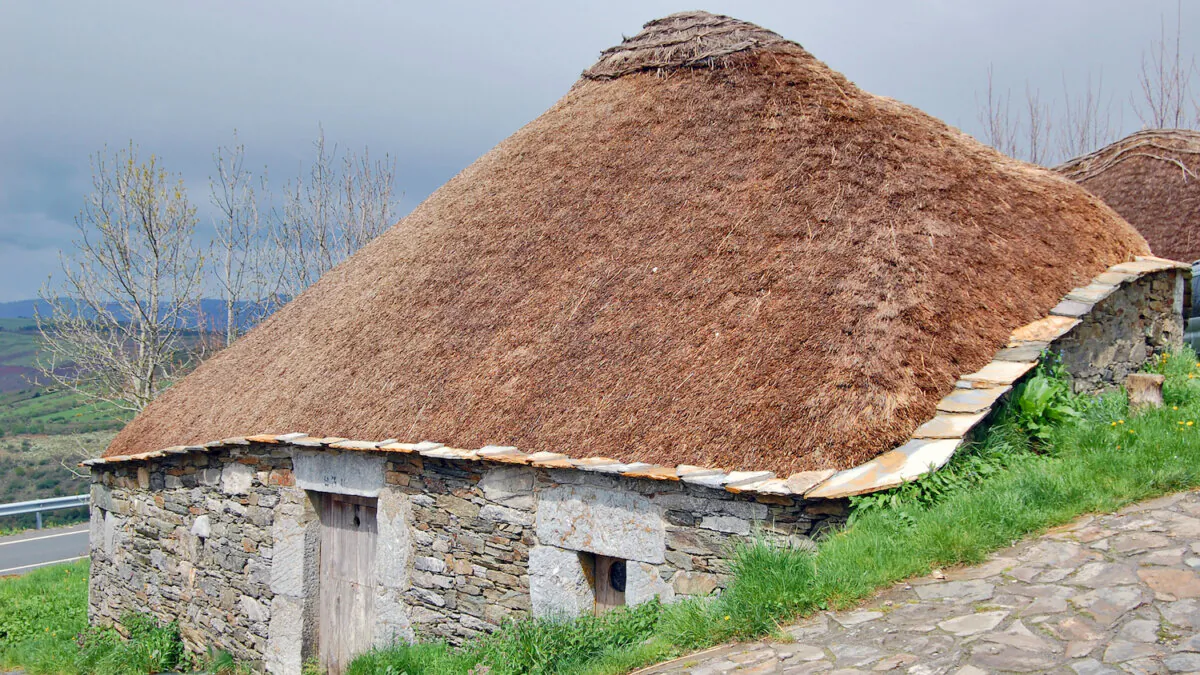 The humble palloza, a round stone hut with a peaked thatched roof, dates back to Celtic times about 1,500 years ago. In the Spanish hamlet of O Cebreiro, on the Camino de Santiago pilgrimage route, residents lived in pallozas until as recently as the 1960s. (Cameron Hewitt, Rick Steves' Europe/TNS)