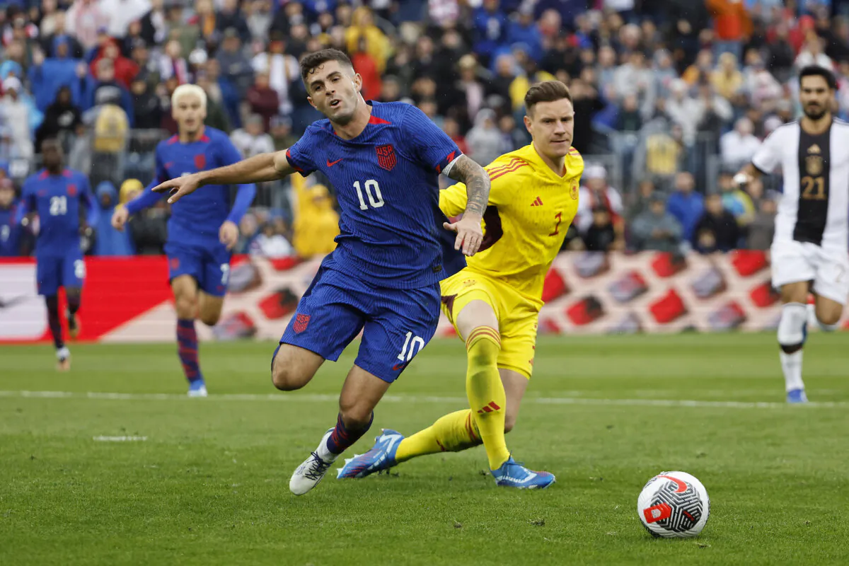 Goalie Marc-Andre ter Stegen (1) of Germany knocks the ball away from Christian Pulisic (10), and Gio Reyna (far L), of the United States during the first half of their International Friendly at Rentschler Field in Hartford, Conn., on October 14, 2023. (Winslow Townson/Getty Images)