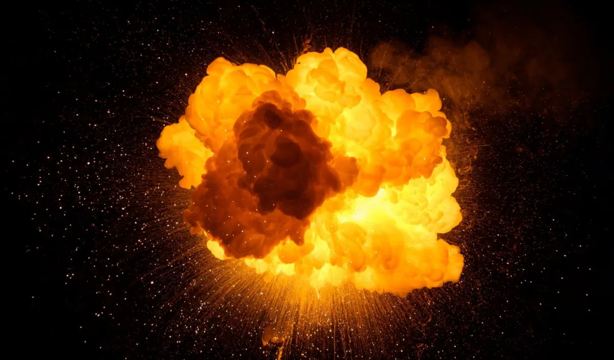 Fiery bomb explosion with sparks isolated on black background. (Michal Zduniak/Shutterstock)