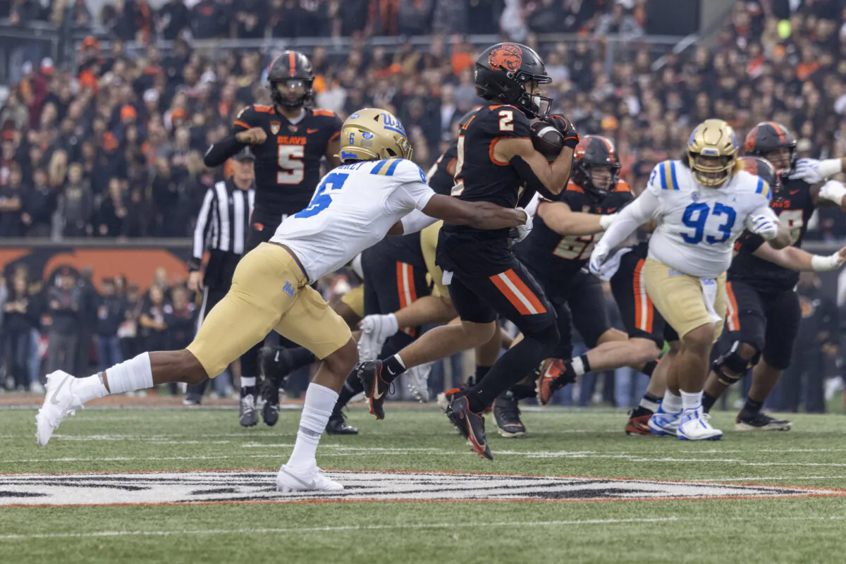 Wide receiver Anthony Gould (2) of the Oregon State Beavers catches a pass against defensive back John Humphrey (6) of the UCLA Bruins during the first half at Reser Stadium in Corvallis, Ore., on Oct. 14, 2023. (Tom Hauck/Getty Images)