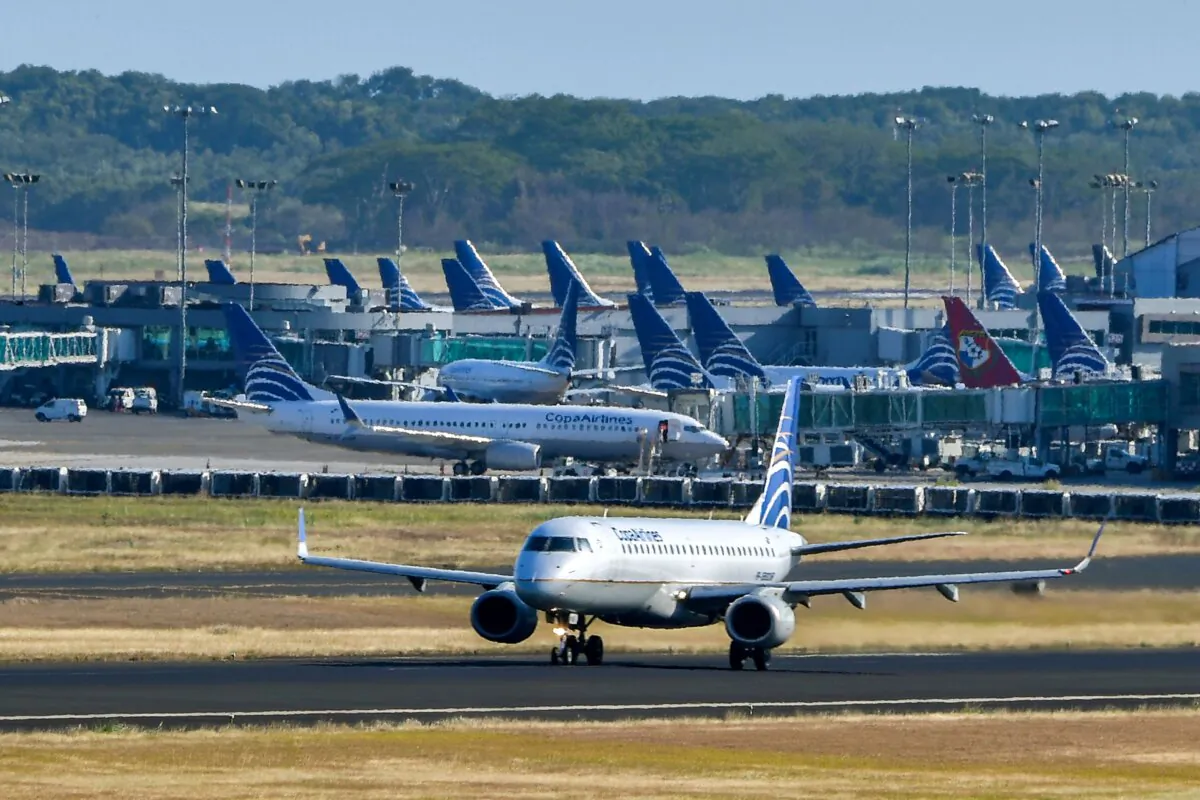 A Copa airlines plane taxis on a runway as others sit on the tarmac at Tocumen International Airport in Panama City in a file photo. (Luis Acosta/AFP via Getty Images)