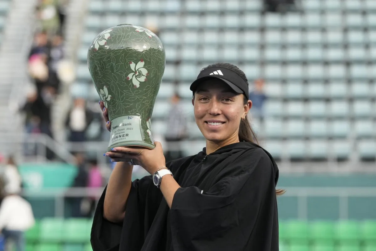 Jessica Pegula of the United States holds up her winning trophy after defeating Yue Yuan of China in their final match of the Korea Open tennis championships in Seoul, South Korea, on Oct. 15, 2023. (Ahn Young-joon/AP Photo)