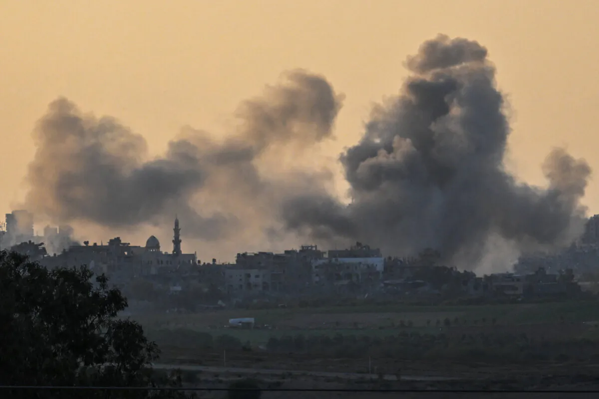 Smoke rises from buildings, viewed from the Israeli side of the border, as the Israeli military conducts a bombardment in northern Gaza on Oct. 15, 2023. (Alexi J. Rosenfeld/Getty Images)