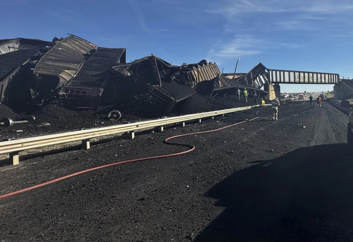 Police respond to the scene of a train derailment near Pueblo, Colo., on Oct. 15, 2023. (Joshua Johnson/Pueblo County Sheriff's Office via AP)