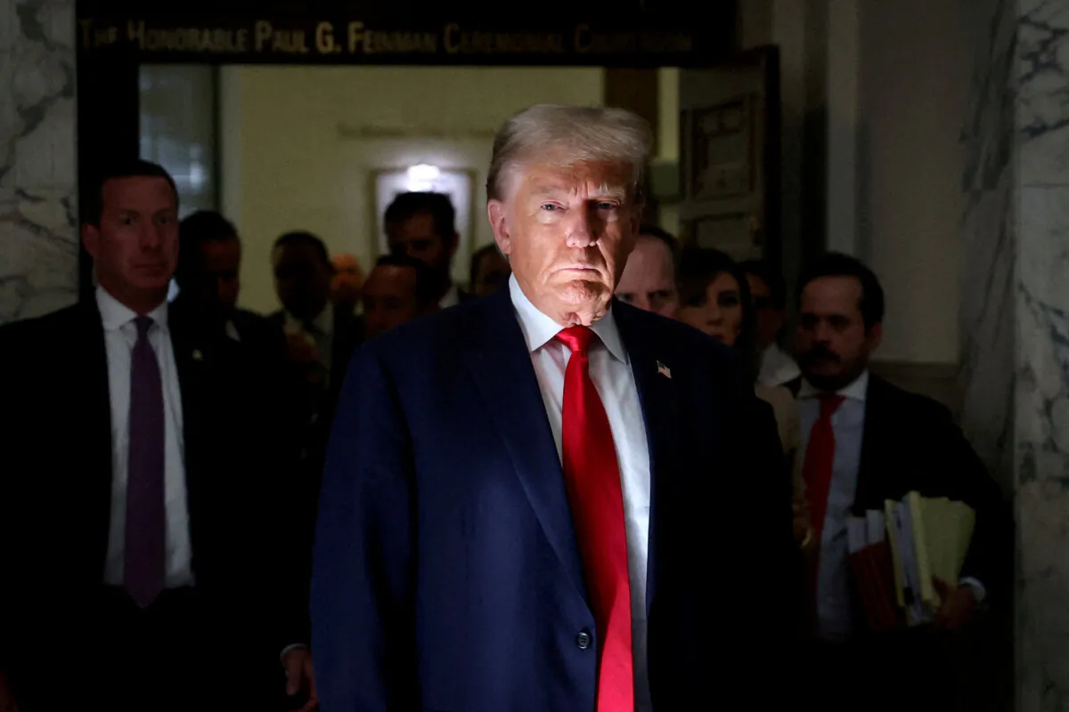 Former President Donald Trump looks on during a break at a Manhattan courthouse as he attends the trial in a civil fraud case brought by state Attorney General Letitia James against him, his adult sons, the Trump Organization, and others in New York City on Oct. 4, 2023. (Mike Segar/Reuters)