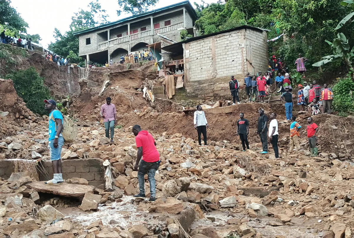 Houses reduced to debris by the landslide in Mbankolo, Yaounde, on Oct. 8. (Nalova Akua)