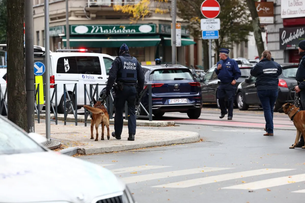 Police officers work after a police operation against a deadly shooting suspect in Brussels on Oct. 17, 2023. (Yves Herman/Reuters)
