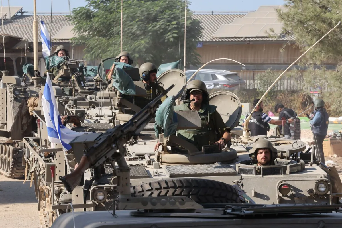 Israeli soldiers are positioned outside kibbutz Beeri near the border with the Gaza Strip on Oct. 15, 2023. (Jack Guez/AFP via Getty Images)