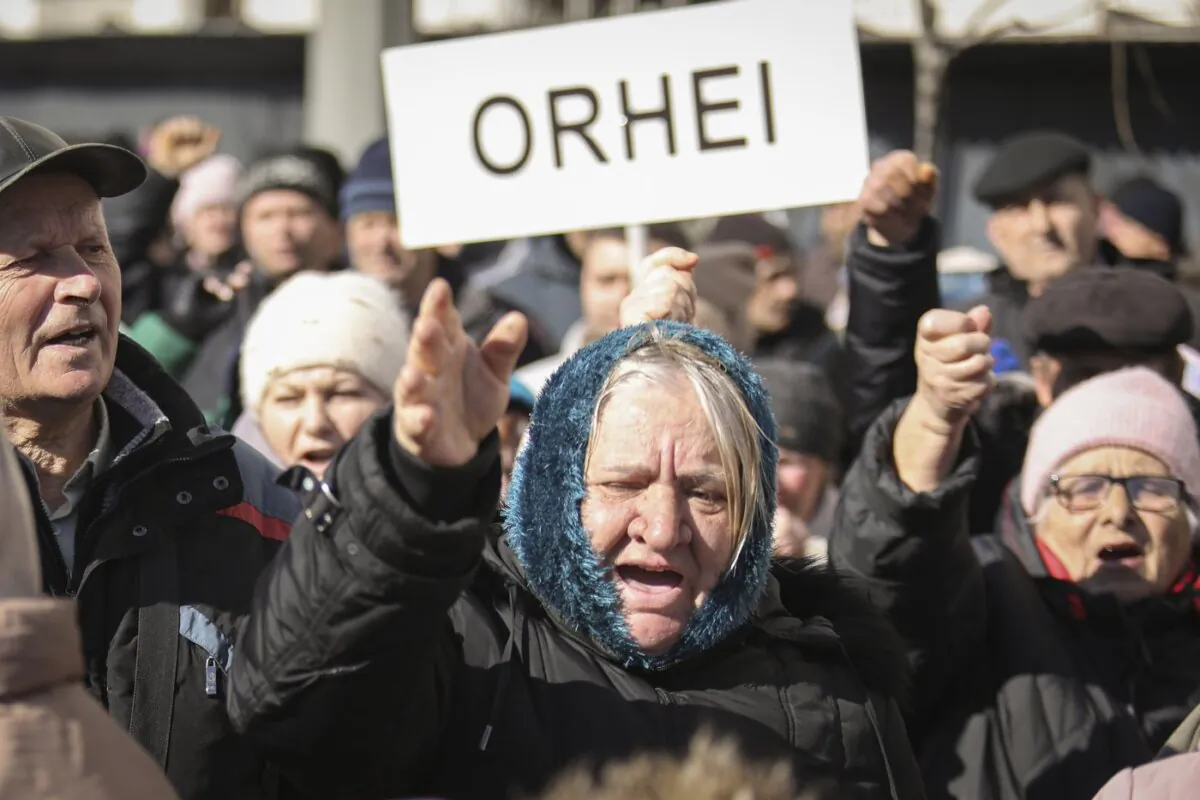People shout anti-government slogans during a protest initiated by the Movement for the People and members of Moldova's Russia-friendly Shor Party, against the pro-Western government and low living standards, in Chisinau, Moldova, on Mar. 12, 2023. (The Canadian Press/AP/Aurel Obreja)