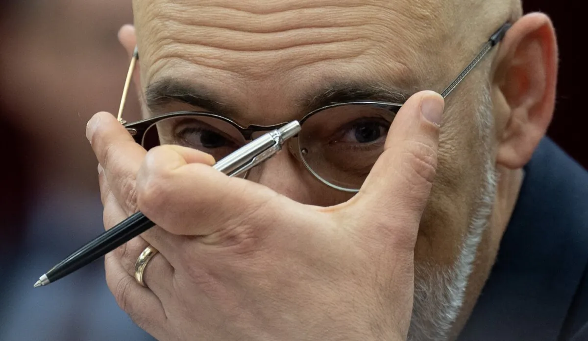 Parliamentary Budget Officer Yves Giroux adjusts his glasses as he waits to appear before the Senate Committee on National Finance, in Ottawa, on Oct. 17, 2023. (The Canadian Press/Adrian Wyld)