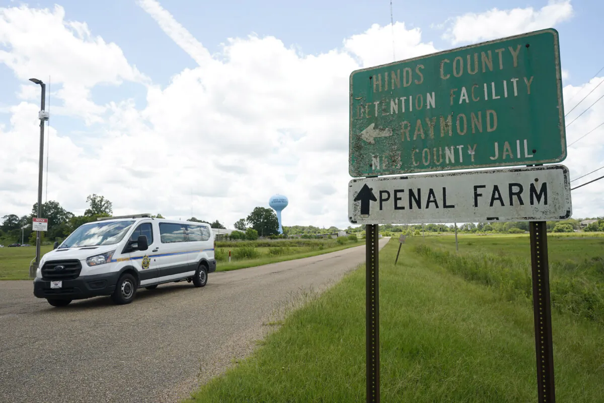 A Hinds County Sheriff's Department van passes the entrance to Hinds County Detention Facility in Raymond, Miss., on Aug. 1, 2022. (Rogelio V. Solis/AP Photo)
