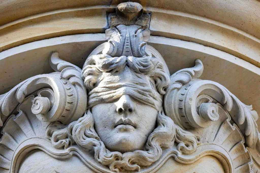 A sculpture of 'Lady Justice" is seen above the entrance of Amtsgericht Charlottenburg (Charlottenburg District Court) in the neighbourhood of Charlottenburg in Berlin on Sept. 5, 2023. (Odd Andersen/AFP via Getty Images)