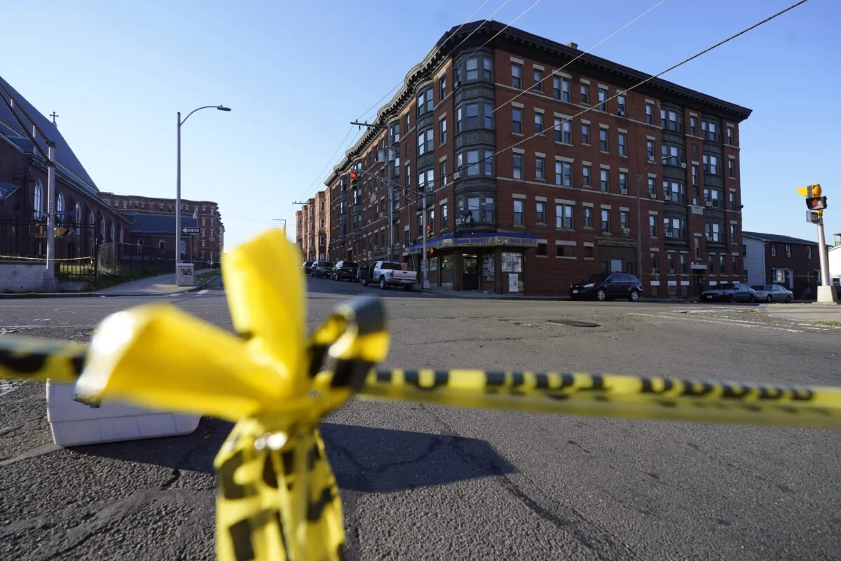 Police tape crosses the street at a scene where multiple people were shot, in Holyoke, Mass., on Oct. 4, 2023. (Steven Senne/AP Photo)