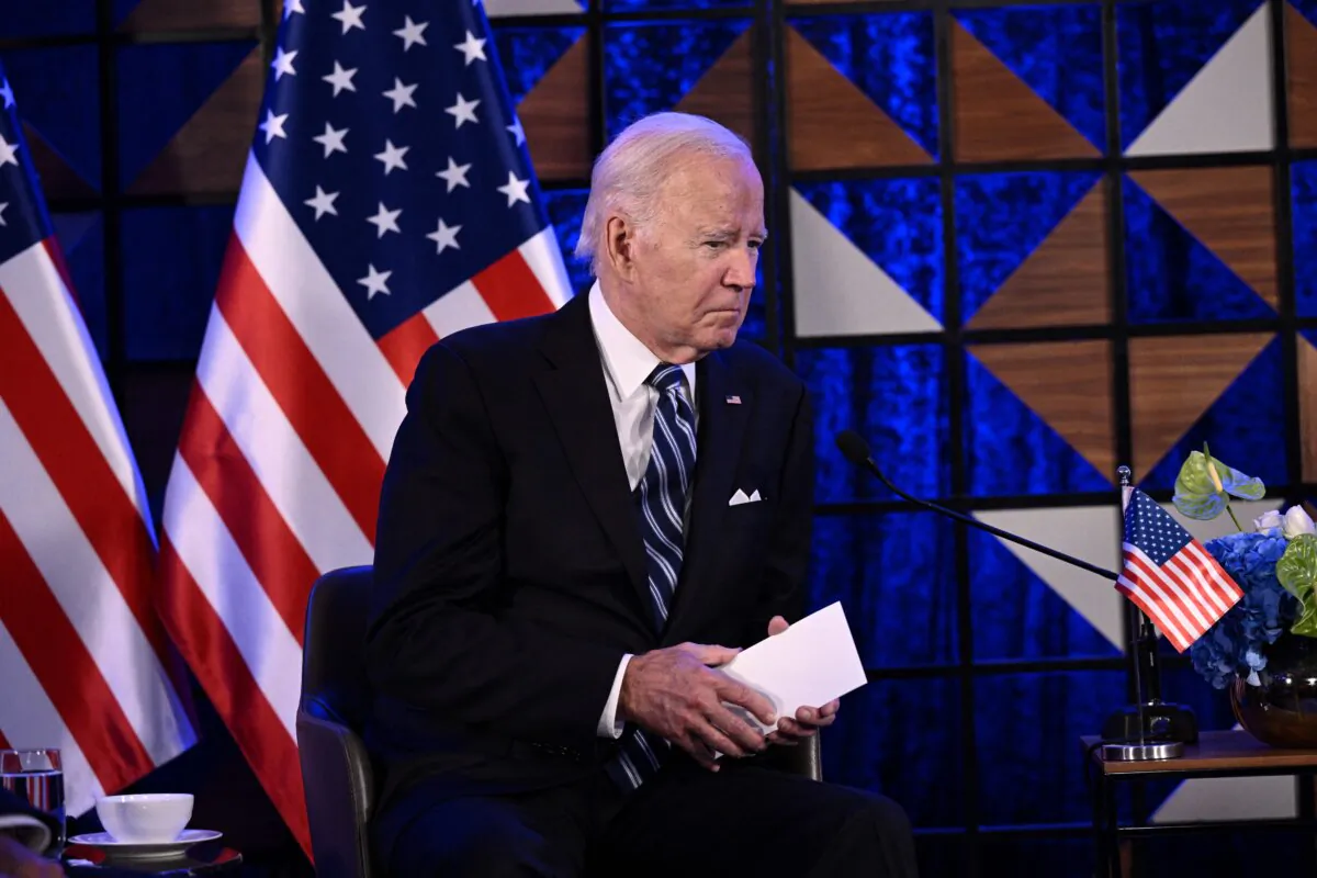 U.S. President Joe Biden listens to Israel's Prime Minister as he makes a statement before their meeting, in Tel Aviv, Israel, on Oct. 18, 2023. (Brendan Smialowski/AFP via Getty Images)