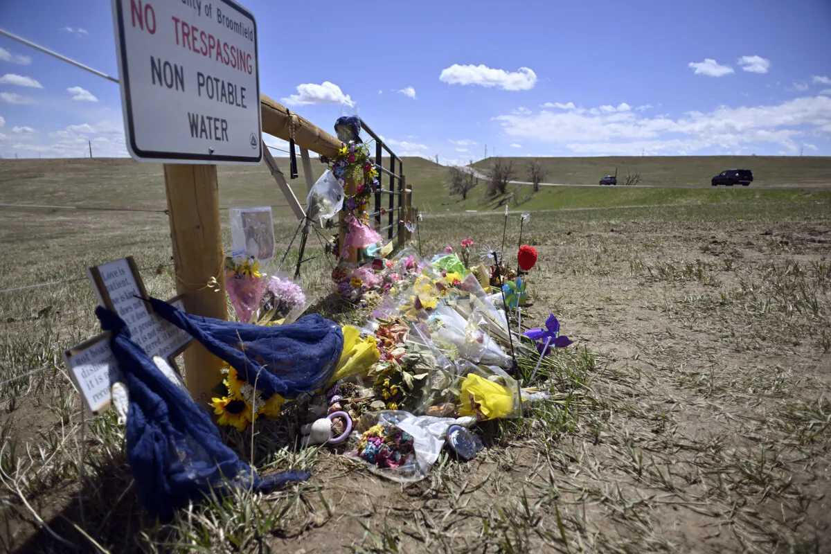 A roadside memorial for Alexa Bartell, who was killed by a rock thrown at her vehicle on April 19, 2023 stands in Broomfield, Colo., on April 28, 2023. (Eric Lutzens/The Denver Post via AP)
