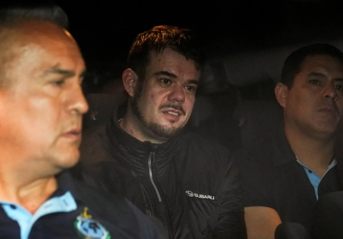 Dutch citizen Joran van der Sloot is driven in a police vehicle from a maximum-security prison to an airport to be extradited to the U.S., on the outskirts of Lima, Peru, on June 8, 2023. (Martin Mejia/AP Photo)
