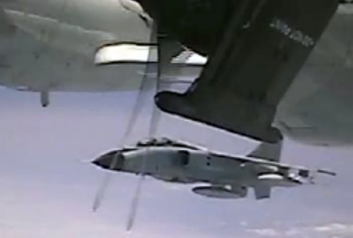 This image from video shows an intercept of a U.S. military plane by Chinese fighter jet over the Pacific Ocean on May 24, 2022. (Department of Defense via AP)