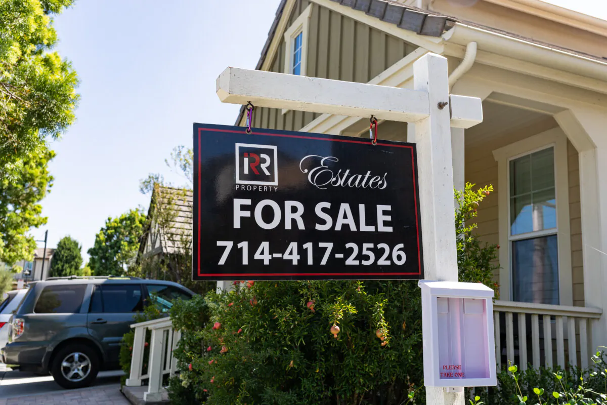 A house carries a "For Sale" sign in Irvine, Calif., on Sept. 21, 2020. (John Fredricks/The Epoch Times)