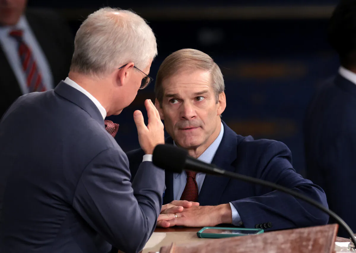 Rep. Jim Jordan (R-Ohio) (R) talks to Speaker Pro Tempore Rep. Patrick McHenry (R-N.C.) as the House of Representatives prepares to hold a vote on a new Speaker of the House at the U.S. Capitol in Washington on Oct. 18, 2023. (Win McNamee/Getty Images)