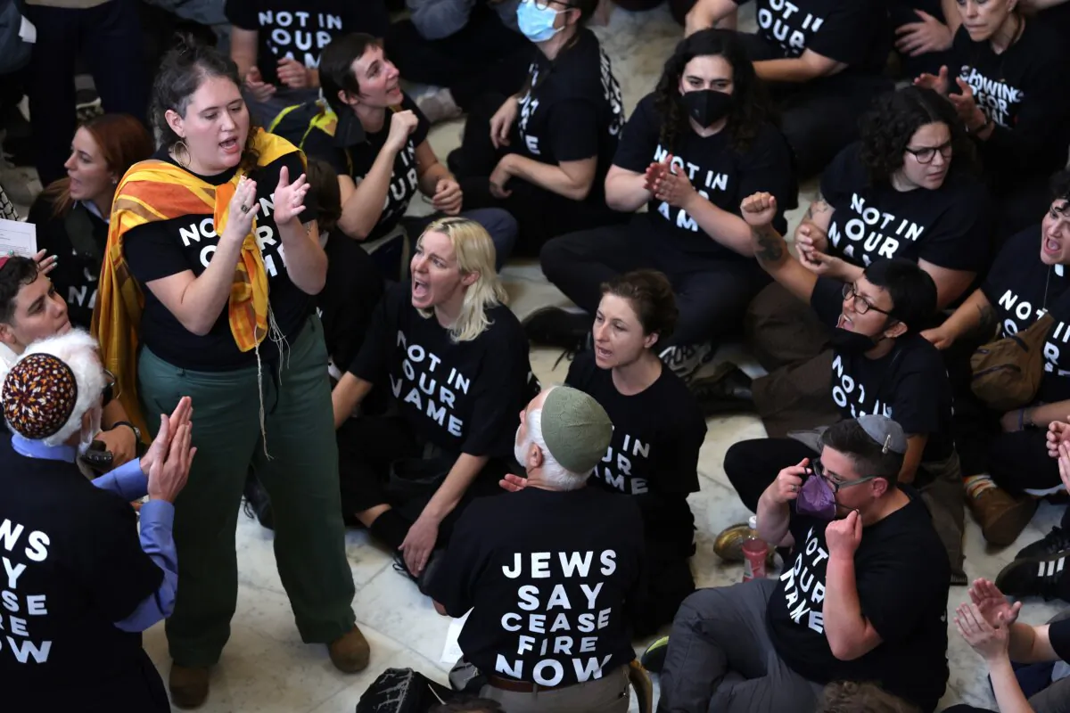 Protesters hold a demonstration in support of a cease fire against the Palestinians in Gaza in the Cannon House Office Building in Washington on Oct. 18, 2023. (Alex Wong/Getty Images)