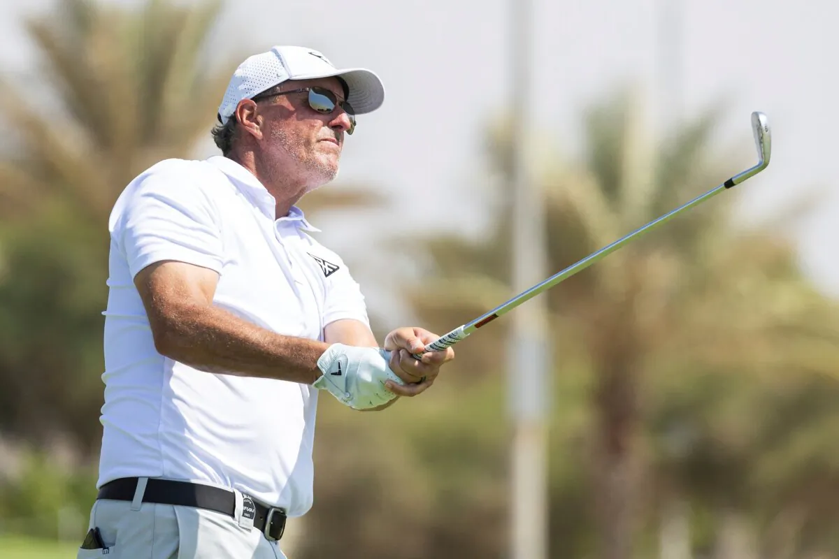 Captain Phil Mickelson of HyFlyers GC hits his shot from the 17th tee during the first round of LIV Golf Jeddah at the Royal Greens Golf & Country Club in King Abdullah Economic City, Saudi Arabia, on Oct. 13, 2023. (Jon Ferrey/LIV Golf via AP)