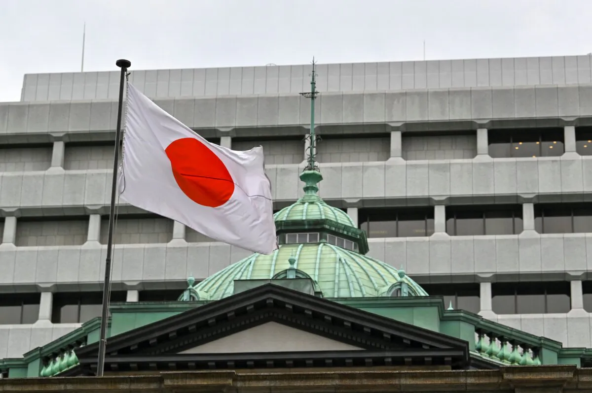 The Japanese flag flutters over the Bank of Japan (BoJ) head office building in Tokyo on April 27, 2022. (Kazuhiro Nogi/AFP via Getty Images)