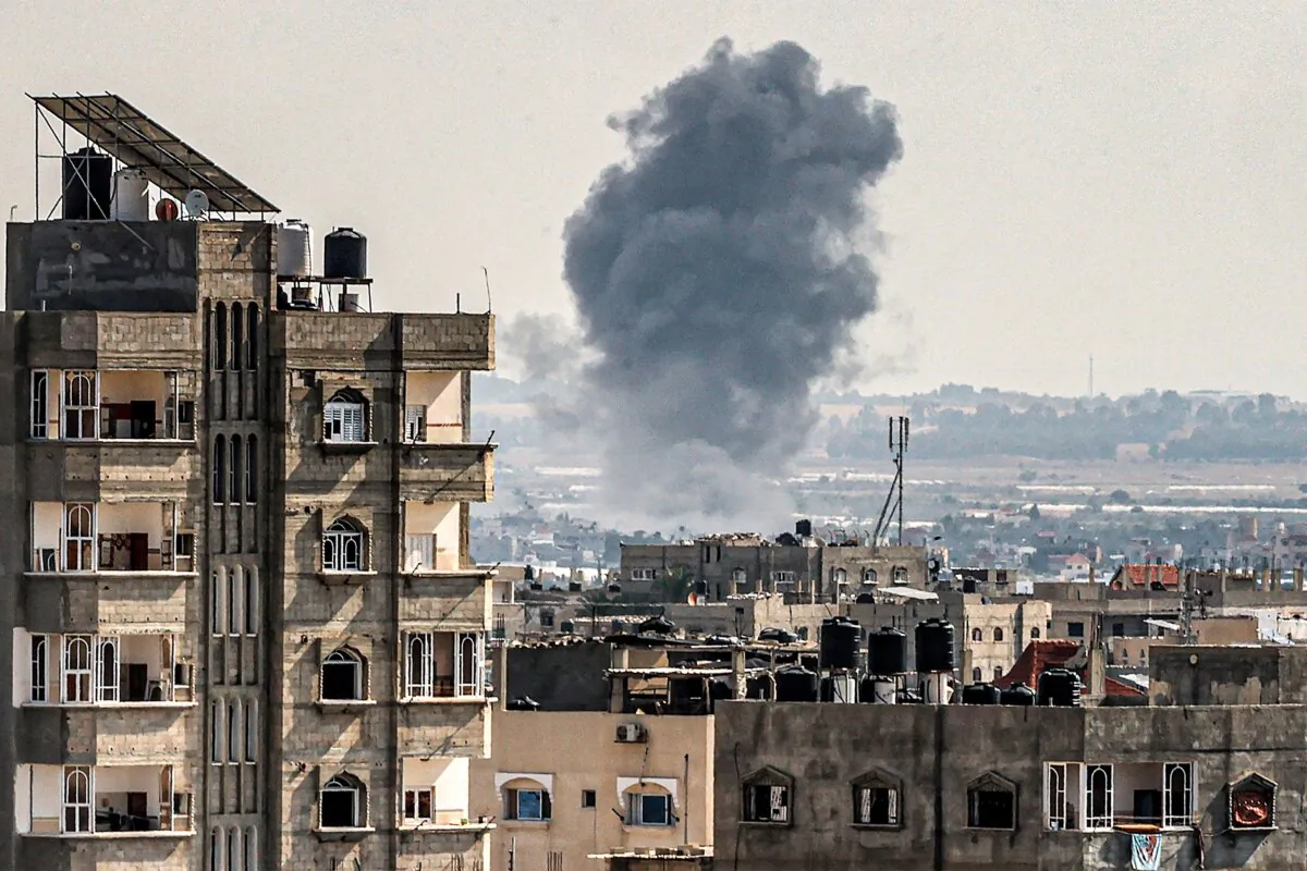 A smoke plume erupts during Israeli bombardment in Rafah in the southern of Gaza Strip, on Oct. 19, 2023. (Said Khatib/AFP via Getty Images)