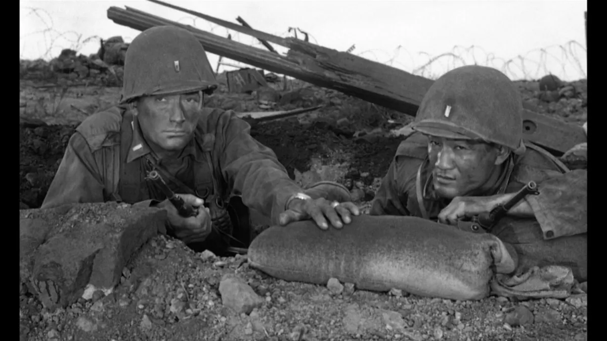 Lts. Joe Clemons (Gregory Peck, L) and Suki Ohashi (George Shibata), in "Pork Chop Hill." (United Artists)